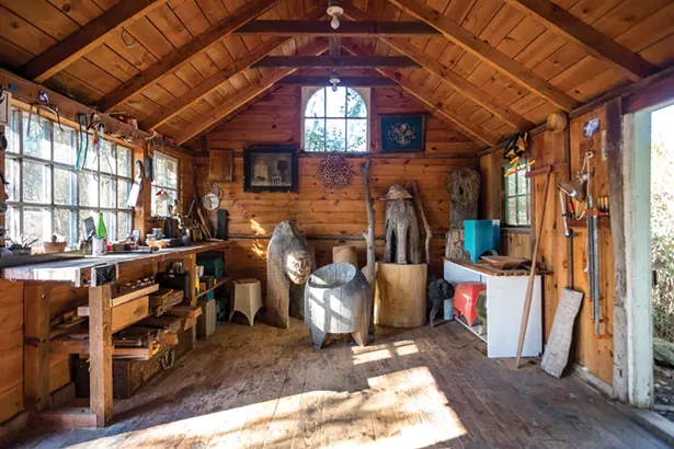Kinsella converted the farm’s former chicken coop into a woodcarving workshop. The couple added a domed window salvaged from their Brooklyn loft. - WINONA BARTON-BALLENTINE
