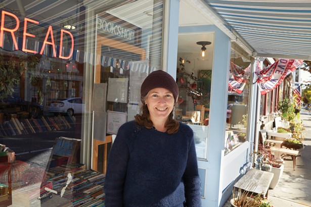 Magpie Bookshop owner Kristi Gibson in front of her second-hand bookstore on Main Street. - PHOTO BY DAVID MCINTYRE
