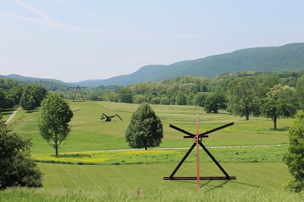 View of the South Fields, all works by Mark di Suvero. From left to right: Pyramidian, 1987/1998. She, 1977-78. Private Collection. Mon Père, 1973-75. Mother Peace, 1969-70. Except where noted, all works Gift of the Ralph E. - Ogden Foundation. ©Mark di Suvero, courtesy the - artist and Spacetime C.C., NY. - PHOTO: STORM KI NG ART CENTER ©2020