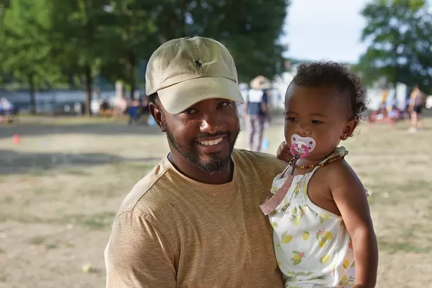 Hudson mayor Kamal Johnson and his daughter. - DAVID MCINTYRE