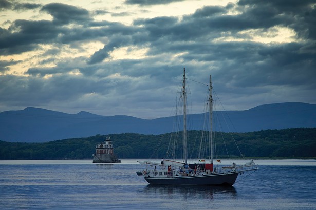 An anomalous cloudy day on the river this summer near the Hudson-Athens Lighthouse with the sail freight schooner Apollonia in the foreground. - PHOTO BY DAVID MCINTYRE
