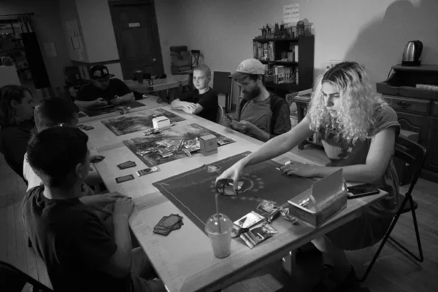 Claire Cohen running a Magic the Gathering tournament at World’s End Comics on Wall Street. - DAVID MCINTYRE
