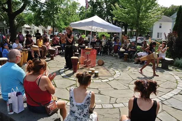 A drum circle on the Woodstock Green - PHOTO BY JOHN GARAY