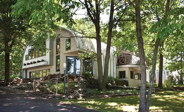 The west facing front of Linda and Andy Weintraub's house. The couple have created a property where the materials utilized—steel and stone, wood and water, and even animal life—all naturally flowing together in "beautiful progressions." - DEBRA DEGRAFFENREID