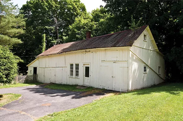 "The Dog House": The couple have converted the home's original barn into a rustic office/den with an adjoining workshop. (Its also where they feed Dean.) - DEBORAH DEGRAFFENREID