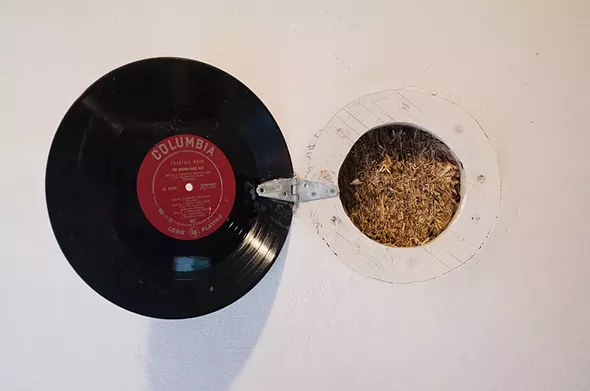 In a wall of Dean Jones's No Parking Studio in Rosendale, a porthole fashioned from an old LP opens to display the core of its straw-bale construction - FIONN REILLY