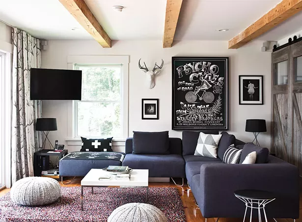 The couple’s living room is decorated with a blend of pieces from each of their lives. “I’m trying to create a haven for people,” Cummings explains about her work. Successful interior design is a combination of understanding the integrity of an individual space, as well as the people who are living in it and how they want to live.” - DEBORAH DEGRAFFENREID