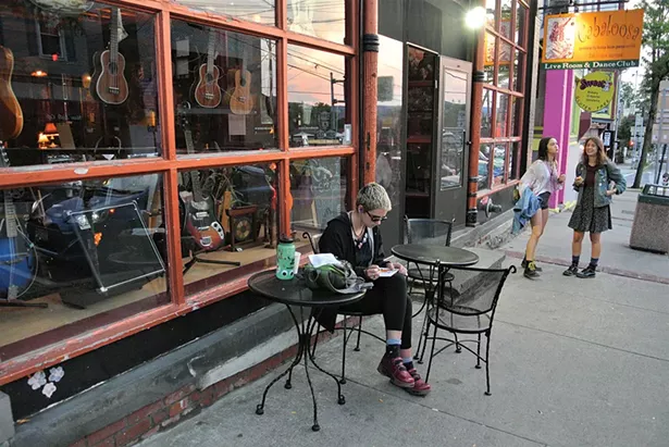 Colleen Rogers, Jade Mogavero and Lily Lavender Wolf in front of Root Note Music and Cafeteria Coffee House. - JOHN GARAY