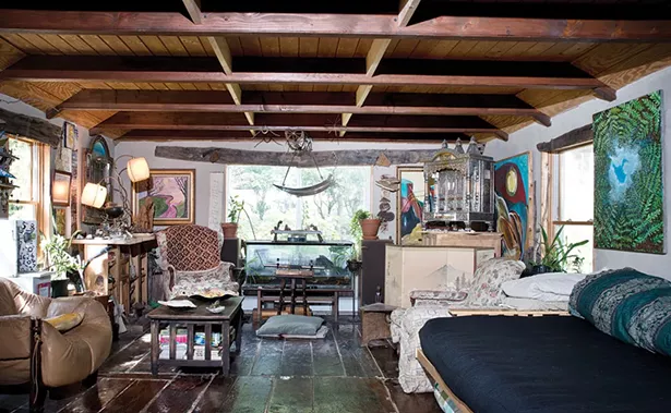 A downstairs addition incorporates hemlock wood salvaged from the property and is decorated with a collection of their own art, works from friends, and works by Perrin’s father, who was also an artist. “The arts are what get us through thick and thin,” explains Perrin. “They are one of the few ways that we make lemonade out of lemons. They are what being human is all about.” - DEBORAH DEGRAFFENREID