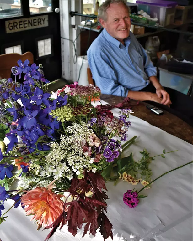 Tim Steinhoff with some of his favorite cut flowers. - LARRY DECKER