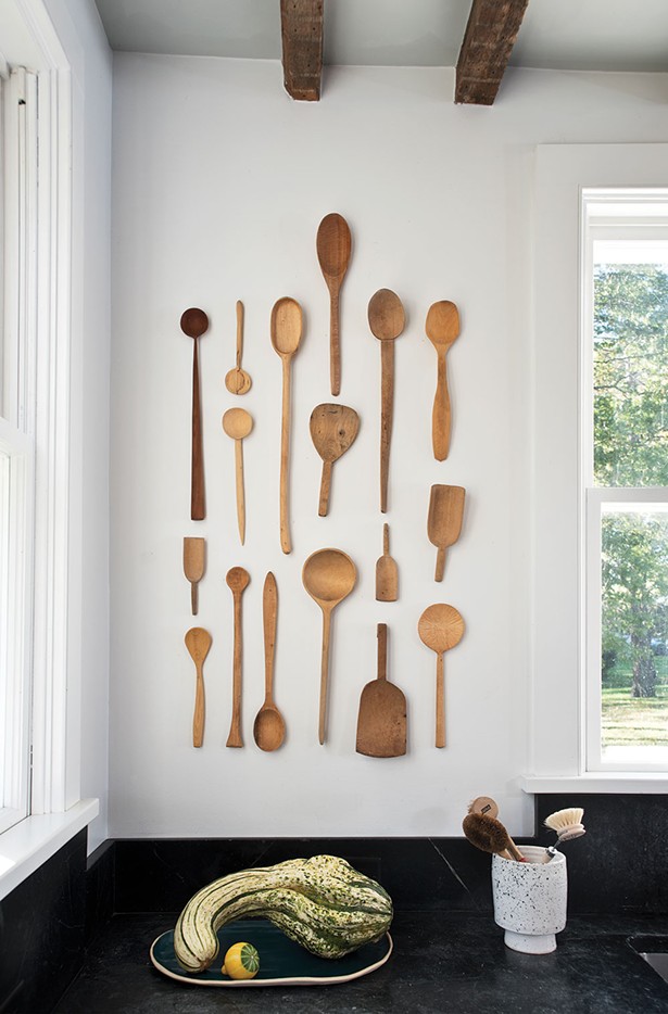 A kitchen wall displays Von Stoddard’s collection of wooden spoons. “I’m very intuitive with my work—I know when something’s good, but have a hard time justifying my decision on a deeper level. I just want things in certain places because it looks better in that place than it looks in another; there’s no other reason.” - DEBORAH DEGRAFFENREID