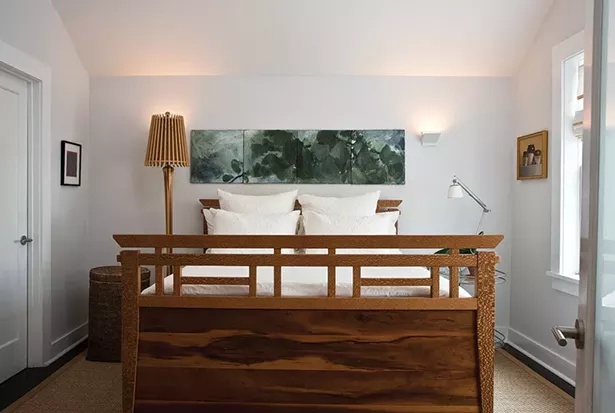 While Smith didn’t add actual space to the home’s second floor, she was able to add spaciousness. Smith is inspired, in part, by Japanese architecture where a simple, contextual aesthetic predominates design. “The negative space is almost more important than what you fill a room with,” she explains. The bed was designed by her brother, Dave Smith, of Ingrain Furniture in Seattle. - DEBORAH DEGRAFFENREID