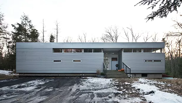 The 1,450-square-foot LV home Bissell shares with partner Bryan Buryk and their daughter Shelby. Designed by architect Rocio Romero, the prefabricated rectangular structure of steel and glass sits on three forested acres and was completed in 2008. - DEBORAH DEGRAFFENREID