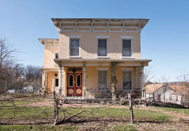 Khorramian’s home dates from 1840 and features many classic Italianate architectural details. A flat roof with a wide overhang is supported with curved cornices and an ornate border. The yellow brick facade and teal trim is also original to the structure. - DEBORAH DEGRAFFENREID