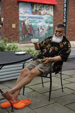 Nasir relaxing in Red Hook. - JOHN GARAY