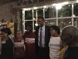 Delgado takes photos with ecstatic supporters. - ANDREW SOLENDER
