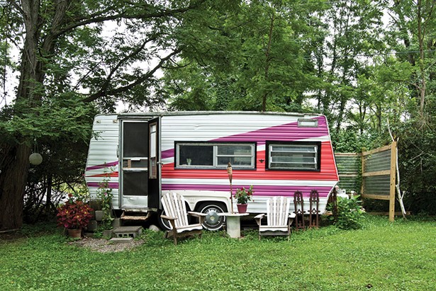 Covelli and Truscott’s 17-foot 1982 Wilderness Camper is tucked away on a corner of their five-and-a-half-acre property. Bought secondhand in New Jersey, they drove it Upstate during a tornado and fully renovated it last year. Now it includes a sleeping area, kitchenette, and lounge. - DEBORAH DEGRAFFENREID