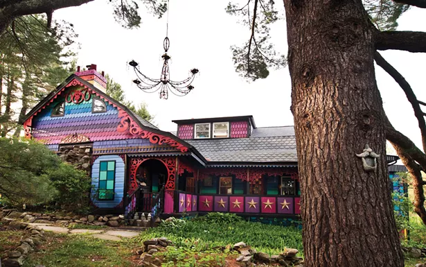 Friends helped paint the house's colorful exterior. O'Sullivan never plans her designs: "I always just know what color should come next," she says. - DEBORAH DEGRAFFENREID