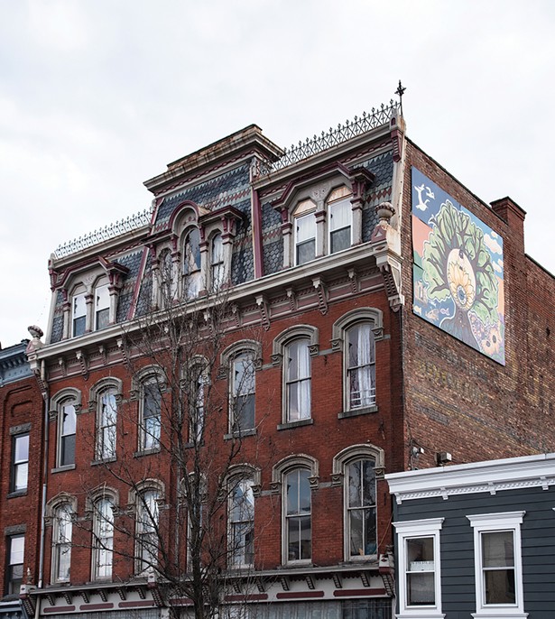Bickman’s loft occupies the top three floors of a former Odd Fellows Temple. Bickman’s mural Timeless Saugerties compliments the building’s 19th century gothic facade. Bickman painted the piece with 9 local young people during the summer of 2017 as part of her Mural Arts Program. - PHOTO BY DEBORAH DEGRAFFENREID