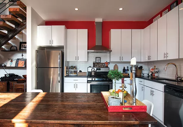 Rice’s kitchen is both the center and heart of her loft. “I love to cook,” she explains, adding that her world travels influenced her culinary tastes. In the year since she moved to the Lofts at Beacon, she’s turned many neighbors into friends and often throws dinner parties in the open, airy space. DJ Red Shoes always makes an appearance after the meal. “Here, after dinner, we always dance.” - PHOTO: DEBORAH DEGRAFFENREID