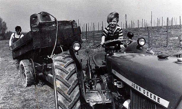 Yancey and Michael's son Tristan, helping around the farm at an early age. Tristan now manages the Wine Club and Whitecliff's wholesale accounts.
