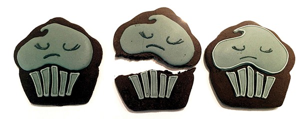 Cookie from the Depressed Cake Shop, a grassroots organization that hosts specialized - pop-up bake sales worldwide to get people - talking about mental health.