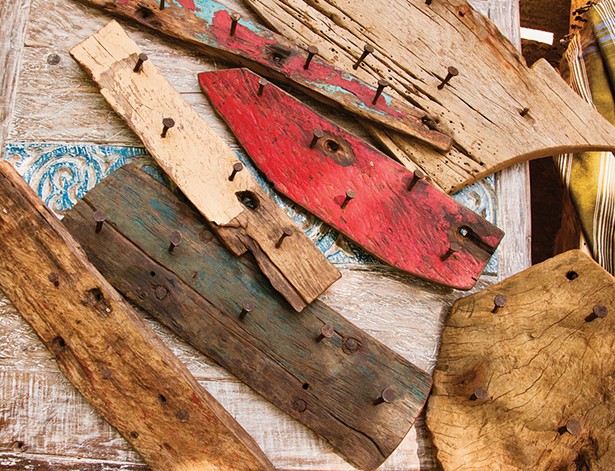 Pieces of wood salvaged from Dhow boats with handmade nails, to be crafted into wall hangers. - PHOTO: MOSES DUMA