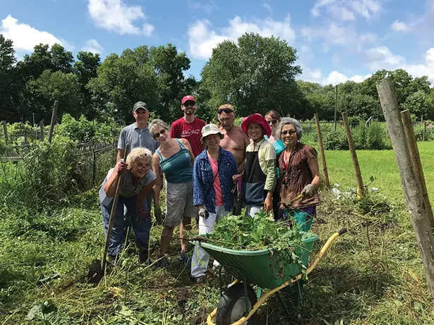 A clean-up crew at a New Paltz Gardens for Nutrition Community Work Day in 2018. - PHOTO: JAIMEE UHLENBROCK