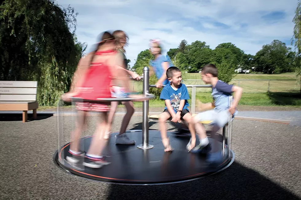 Luke Cirillo (in focus) and friends at Stanley-Demming Park playground, where ADA park construction has begun. - PHOTO: CHRISTINE ASHBURN