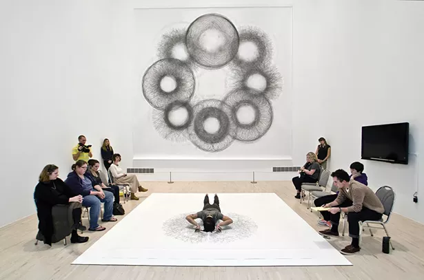 Tony Orrico creating a Penwald Drawing, part of a series of bilateral drawings exploring the use of the body as a tool of measurement to inscribe geometries through movement. - PHOTO COURTESY OF THE HUDSON EYE FESTIVAL