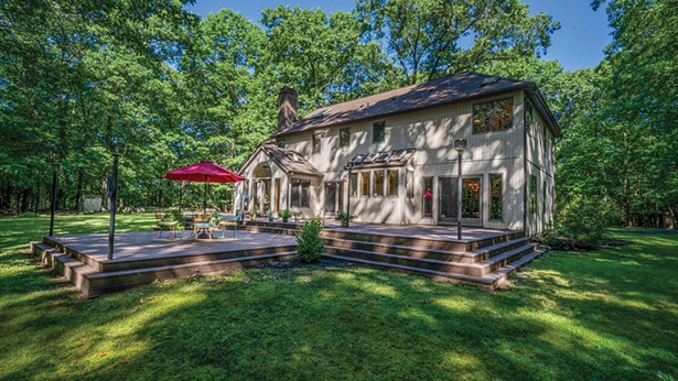 On the market for the first time since its construction in 1988, this spacious and tranquil custom-built contemporary rests on 54 private, wooded, subdividable acres a half mile from Main Street in Rosendale. The nearly 3,000-square-foot rural retreat features an openfloor plan with hardwood and marble; expansive eat-in kitchen with an island and custom built-in refrigerator; three large bedrooms with walk-in closets and skylights; a massive basement with high ceilings and Bdry system; and an oversized attached two-car garage with storage loft. A rare find in a historic Ulster County hamlet, this home is priced to sell at less than $850,000.