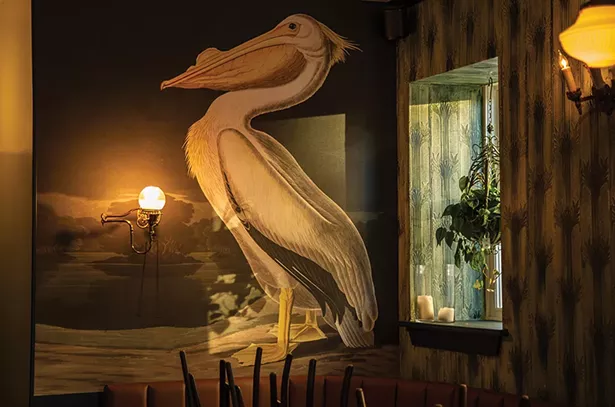 A mural of a stately pelican presides over - the restaurant from the back wall - PHOTO: BRIAN WOLFE