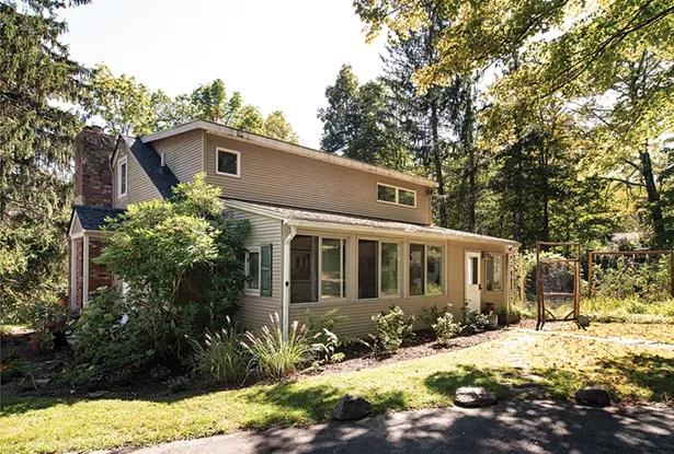 When they bought the 1946 Cape Cod in 2018, it included vestiges of a large perennial garden planted in the 1970s. The couple have been working to bring it back to life, as well as planting - an heirloom vegetable garden to supply their guests’ meals. - PHOTO: DEBORAH DEGRAFFENREID