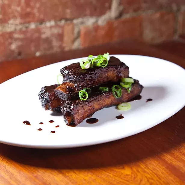 Jerk ribs tossed in sherry-tamarind glaze at Essie's Restaurant in Poughkeepsie. - PHOTO CREDIT: ALAN BATTMAN