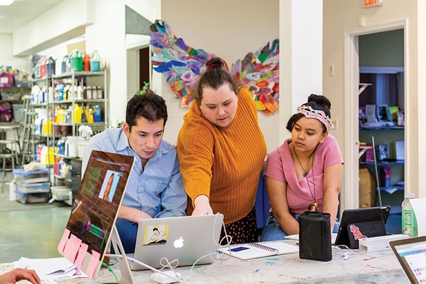 David Wong and Sarah Timberlake Taylor work with a student at The Art Effect in Poughkeepsie. The Art Effect, a merger of two longstanding arts nonprofits, Mill Street Loft and Spark Media Project, works in arts education and youth development across the region. - PHOTO: ANNA SIROTA