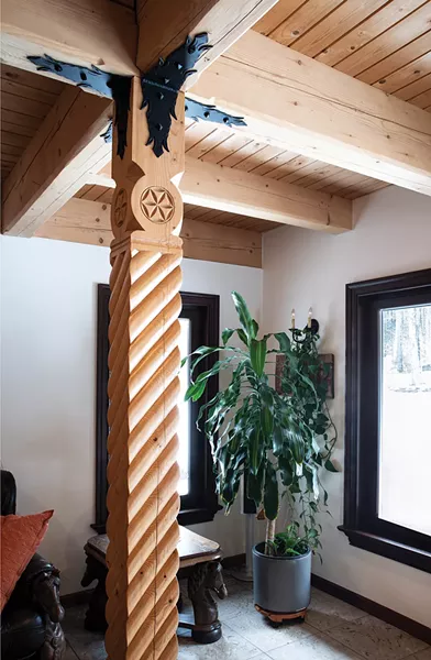 Wanting to create a Zakopane home that was as authentic as possible, Laroux’s Polish born parents Benjamin and Juliette Laroux commissioned a majority of the 8,000 square foot building’s materials from Podhale and then - erected the structure on a Polish mountainside. - “All the carvings were hand done on the spot in - the mountains there,” says Laroux. - PHOTO BY DEBORAH DEGRAFFENREID