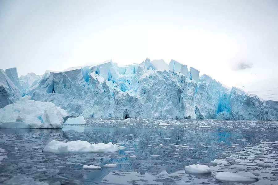 The blue hue marks the age of the ice—created from decades of snowfall and enormous amounts of pressure that squeeze out all the air bubbles to form an incredibly dense and brilliantly blue frozen mass. - PHOTO BY MADELINE COTTINGHAM