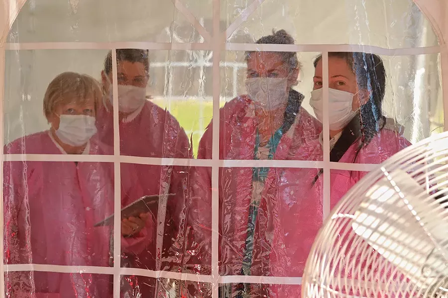 Nurses at the coronavirus drive-through testing center at Dutchess Stadium. - PHOTO BY ROSS CORSAIR