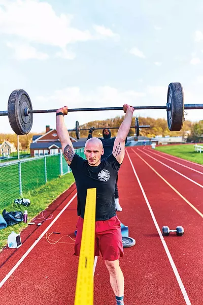 Brandon and J.D. lifting weights in Catskill, from Alon Koppel's series "6 Feet Apart." - ALON KOPPEL