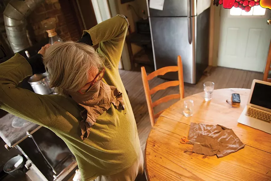 "The other day we made masks. The first batch were made out of vacuum bags. We quickly learned they weren't breathable. Eventually we came up with a simple mask made out of t-shirts. Here is my mother, Jennifer Cottingham, trying one on." - MADELINE COTTINGHAM
