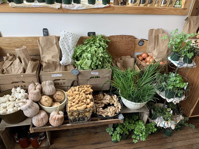 Village Coffee and Goods has expanded their grocery section, including a spread of fresh produce. - VILLAGE COFFEE AND GOODS