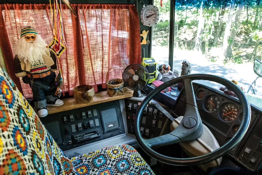 The front seat of Julie Snyder’s bus, which she’s named Brigantia. The bus is drivable and Snyder has taken it all over the northeast. “It fits in exactly two parking spaces, end to end,” she explains. - PHOTO BY WINONA BARTON-BALLENTINE