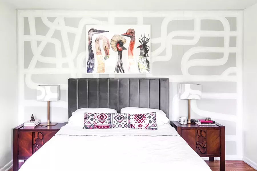 Top: The home’s master bedroom features a custom mural and matching lampshades by Red Hook-based artist Rowan Willigan. The painting of birds above the bed is by Michelle Morin. “A love of birds is embedded in my culture,” says Schultz. “Parrots and toucans are a part of the ecosystem in Brazil. And now I love the beautiful birds of the Northeast.” - PHOTO BY WINONA BARTON-BALLENTINE