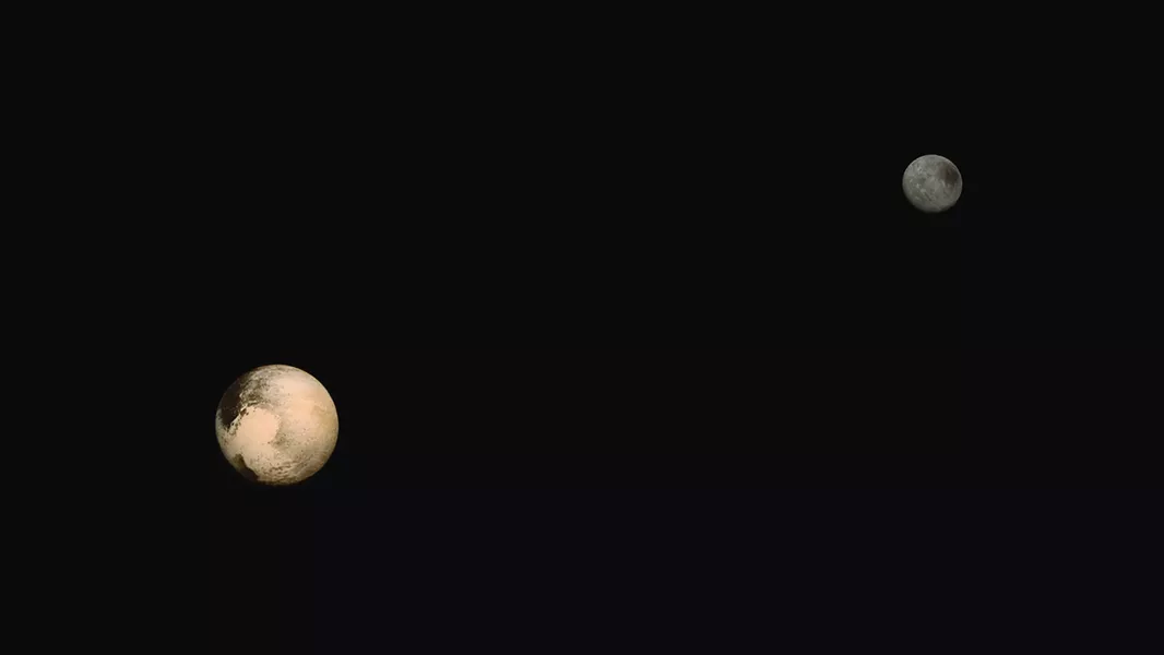Charon and Pluto in deep space.