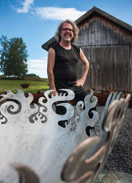 John T. Unger with a metal fire bowl of his construction. - ROY GUMPEL