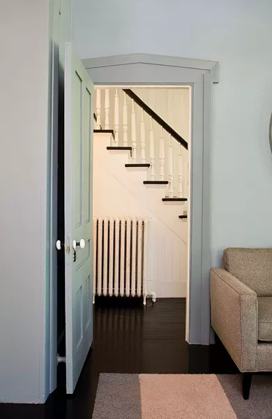 The couple has restored the home's original staricase. "We had to custom mill the spindles and custom build the new bannister," Sexton says. - DEBORAH DEGRAFFENREID
