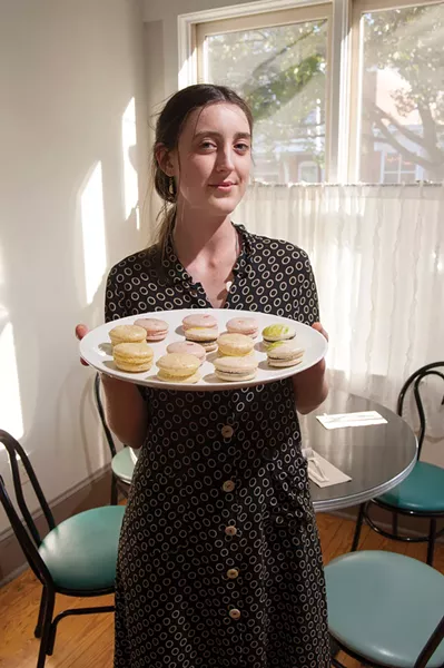Joy Risk at Plantae in Tivoli with a plate of macaroons. - CHRISTINE ASHBURN