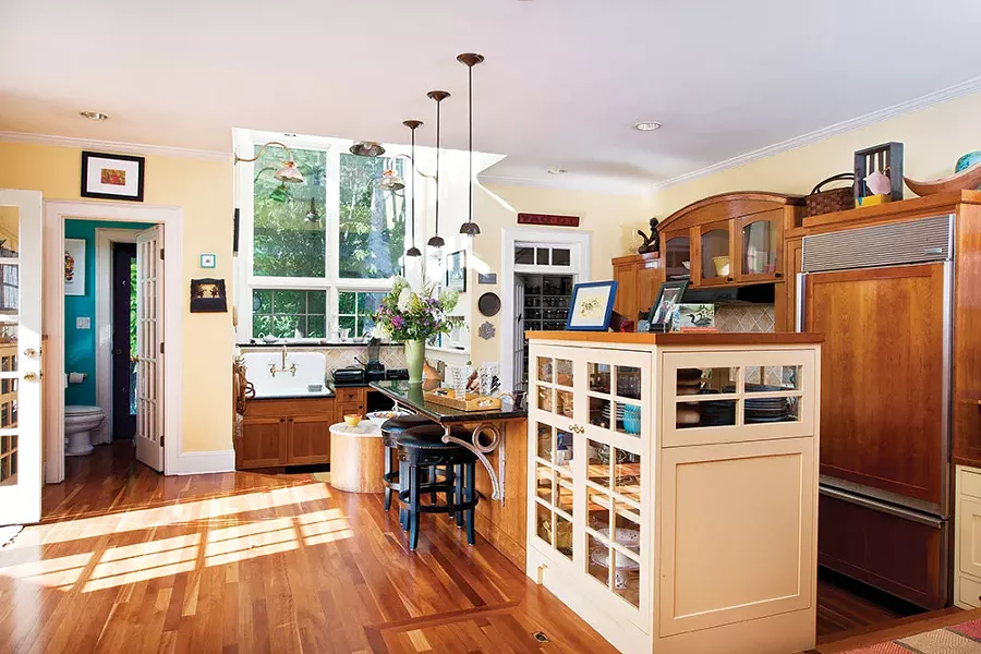 The couple converted Frasier's original north facing painting studio into a large kitchen, adding an arch of windows and skylights over the kitchen sink. - DEBORAH DEGRAFFENREID