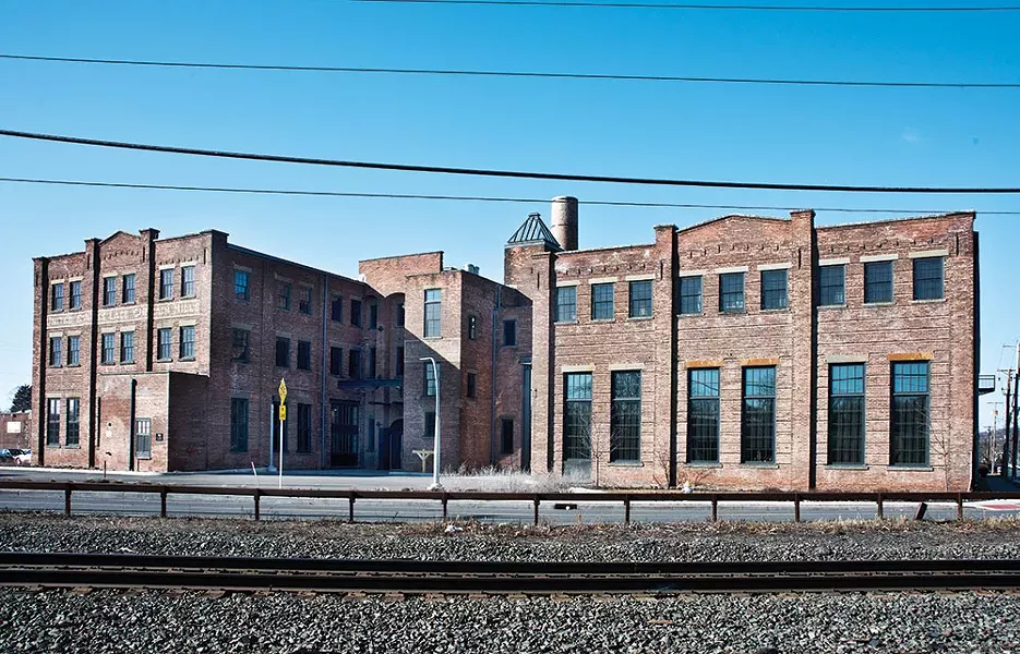 The former US Curtain Factory. Once a thriving manufacturing center, in 2013 the building was converted into 55 units of affordable artist housing; including studios, one-, two-, and three-bedroom units with varying layouts, as well as share-studio and gallery spaces. - DEBORAH DEGRAFFENREID
