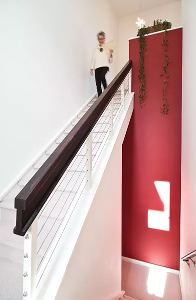 Meyer-Fitzsimmons in the stairwell leading to her home office. She began her research for her Master’s degree—which was to become her book Deep Living—in the `90s and found she really enjoyed the writing process. “It’s sort of like constructing a puzzle out of pieces of information.” - DEBORAH DEGRAFFENREID